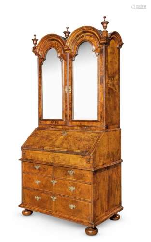 A QUEEN ANNE FIGURED WALNUT AND FEATHER BANDED BUREAU CABINE...