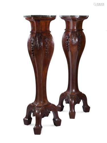 A LARGE PAIR OF CARVED WALNUT TORCHERE STANDS, IN GEORGE II ...