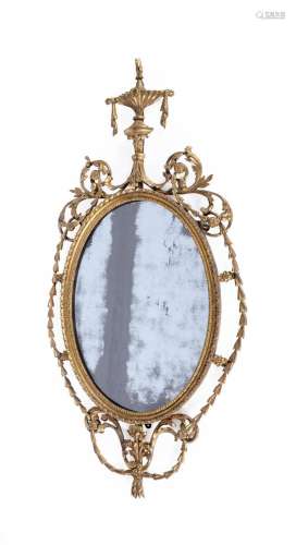 A GEORGE III CARVED GILTWOOD OVAL WALL MIRROR, IN THE MANNER...