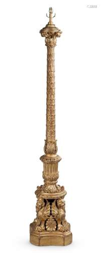 AN ORNATE CARVED GILTWOOD STANDARD LAMP, IN CLASSICAL STYLE,...