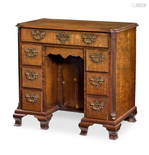 A GEORGE III 'FUSTIC' MAHOGANY KNEEHOLE DESK, CIRCA 1770