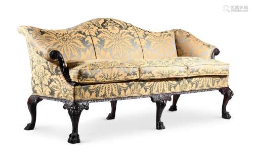 A CARVED MAHOGANY AND UPHOLSTERED SOFA, IN GEORGE II STYLE, ...