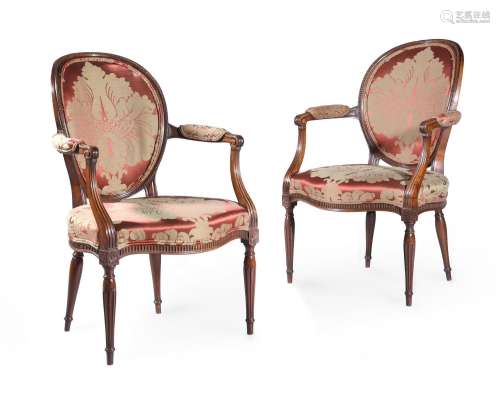 A PAIR OF GEORGE III MAHOGANY ARMCHAIRS, IN THE MANNER OF JO...