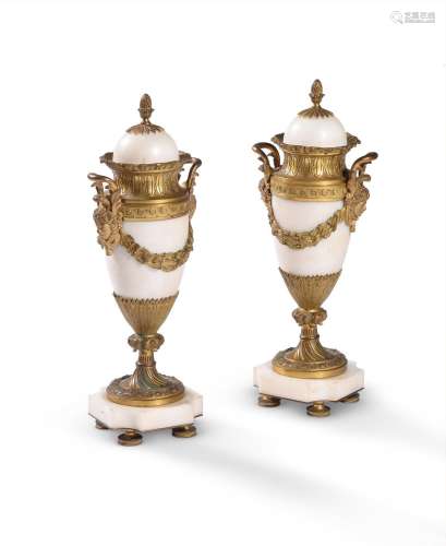 A PAIR OF WHITE MARBLE AND ORMOLU PEDESTAL URNS, PROBABLY IT...