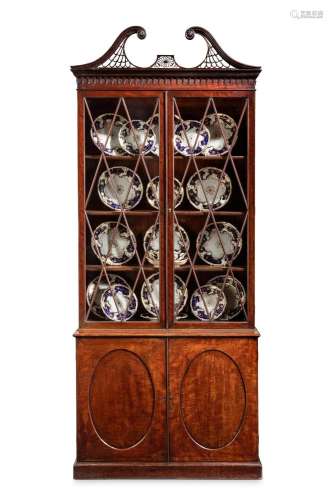 A GEORGE III MAHOGANY BOOKCASE, IN THE MANNER OF WILLIAM BRA...