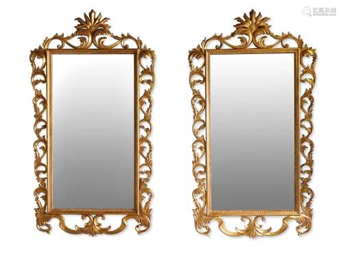A LARGE PAIR OF ITALIAN CARVED GILTWOOD WALL MIRRORS, IN 18T...