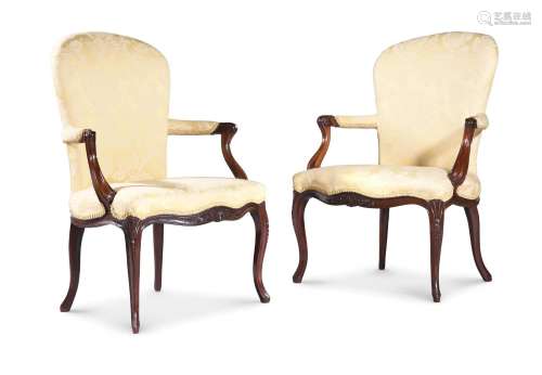 A PAIR OF GEORGE III MAHOGANY AND UPHOLSTERED OPEN ARMCHAIRS...