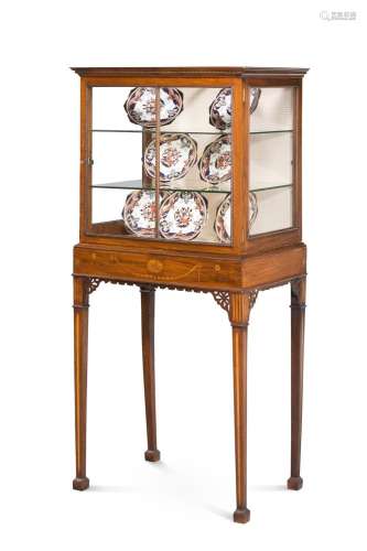 A MAHOGANY AND MARQUETRY GLASS DISPLAY CABINET ON STAND, CIR...