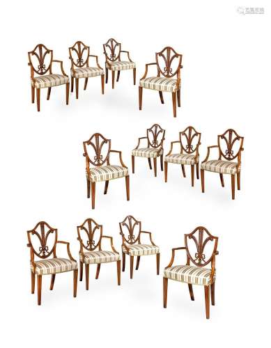 Y A CLOSELY MATCHED SET OF TWELVE SATINWOOD DINING ARMCHAIRS...