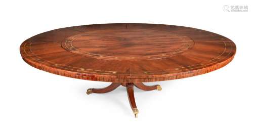 Y A REGENCY ROSEWOOD AND BRASS INLAID CONCENTRIC DINING TABL...