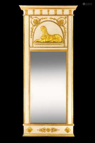 A NORTH EUROPEAN CREAM PAINTED AND PARCEL GILT MIRROR, FIRST...