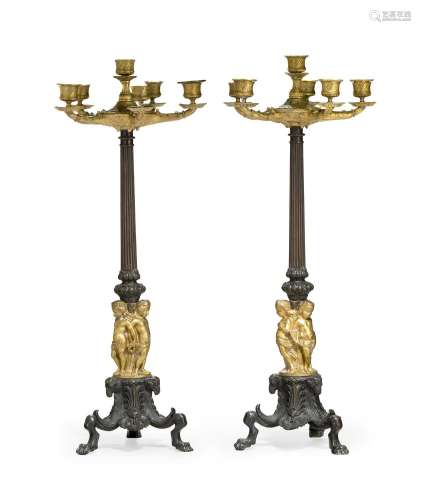 A LARGE PAIR OF PATINATED AND PARCEL GILT SIX LIGHT CANDELAB...