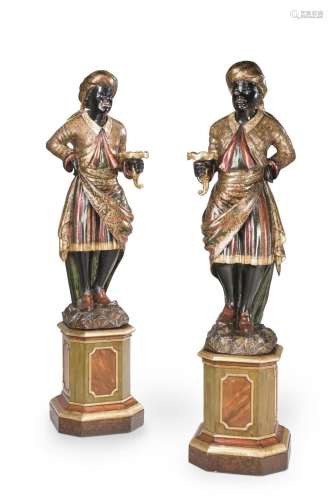 A GOOD PAIR OF CARVED AND POLYCHROME STANDING 'BLACKAMOOR' F...
