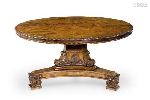 A REGENCY FIGURED AND CARVED MAHOGANY CENTRE TABLE, IN THE M...