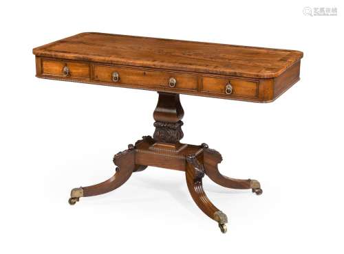 Y A REGENCY MAHOGANY AND ROSEWOOD CROSSBANDED LIBRARY TABLE,...