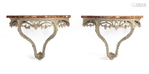 A PAIR OF CREAM AND PALE BLUE PAINTED CONSOLE TABLES, IN GEO...