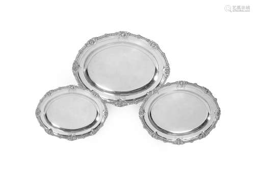 A GEORGE III SET OF THREE SILVER GRADUATED OVAL MEAT PLATES,...