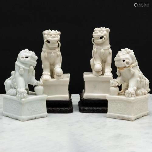 Two Pairs of Blanc de Chine Porcelain Buddhistic Lion Joss S...