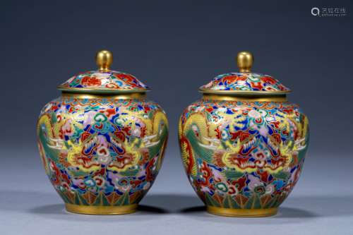 A pair of Qianlong style pastel two dragons playing with bea...