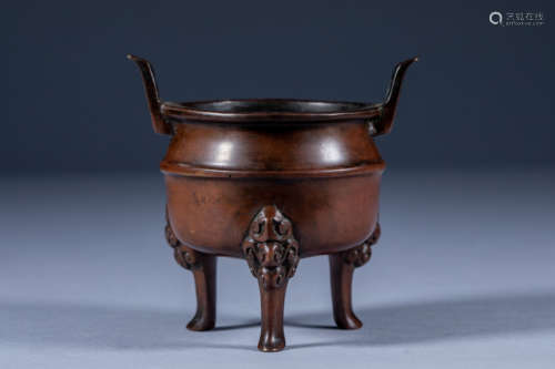 Three-legged and double-eared incense burner in the treasure...