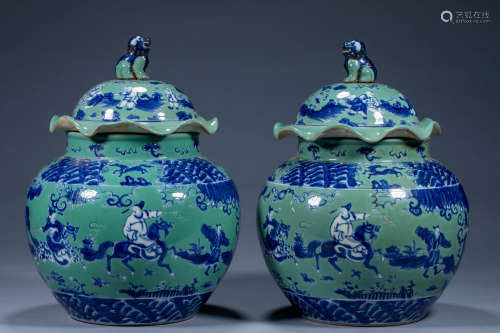 A pair of green-glazed blue-and-white figure lace lidded jar...