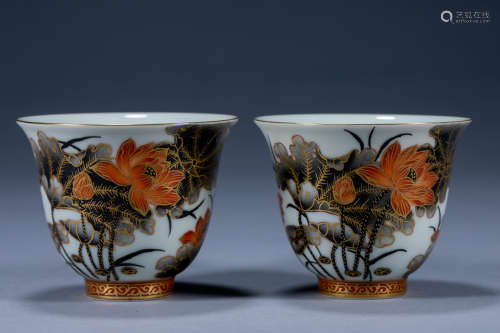 A pair of Qingqu small cups painted in gold and ink lotus lo...