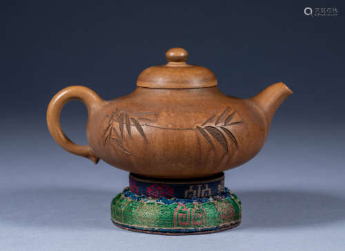 An ancient Chinese zisha teapot made from an oblique Yang Pe...