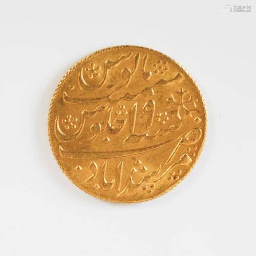 A Middle Eastern yellow metal coin, 12.3grams