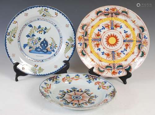 A group of three Delft pottery chargers, 18th century, one d...