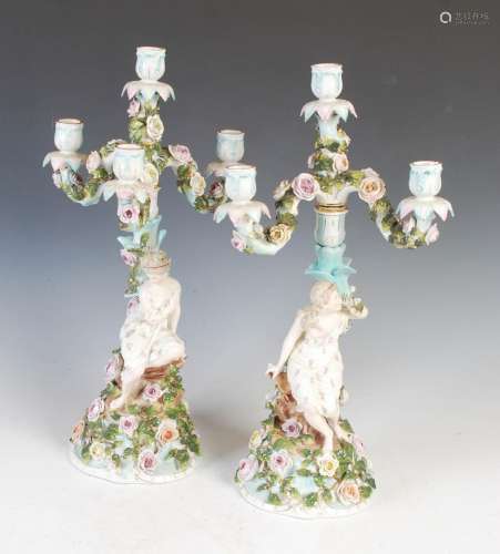 A pair of Sitzendorf porcelain four-light candelabra, the fl...