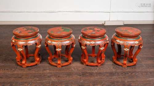 A set of four Chinese red lacquered garden stools, 19 in. (4...