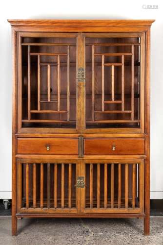 A Chinese wood shelves enclosed by lattice rails and doors, ...