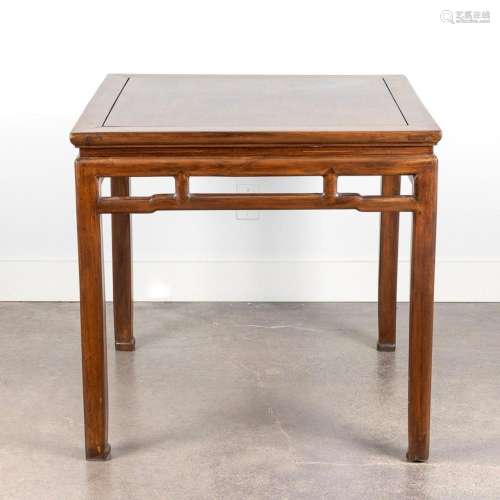 A Chinese hardwood rectangular topped table with hipped stre...