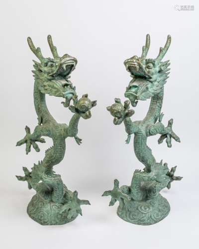 A large pair of green patinated bronze dragons, 40 in. (102 ...