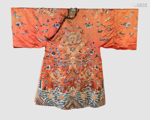 A Chinese Qing dynasty coral silk ground embroidered dragon ...
