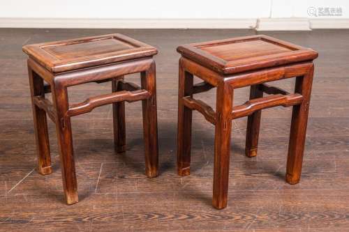 A pair of Chinese hardwood rectangular waisted stools, 17 1/...