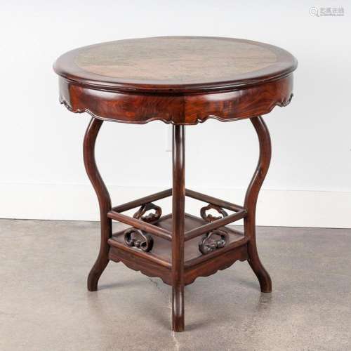 A Chinese Qing dynasty rosewood round table, 31 x 31 3/4 in....