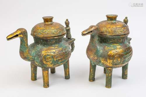 A pair of Chinese archaic style bronze vessels and domed cov...