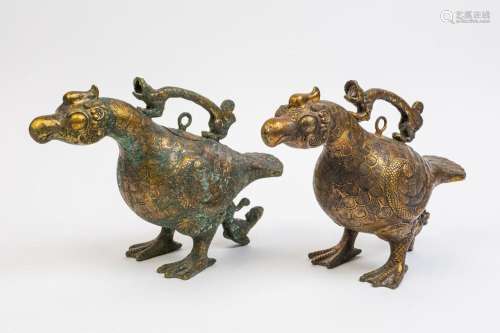 A pair of Chinese cast bronze ewers and covers