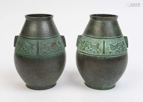 A pair of Japanese bronze vases of ovoid form,