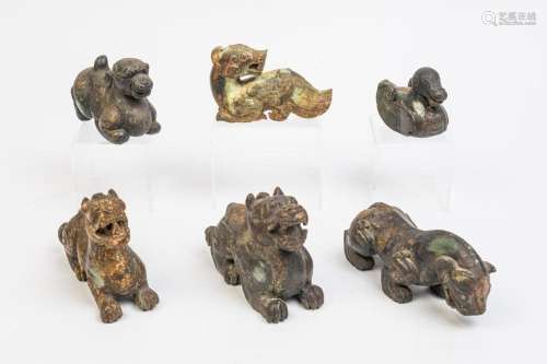 Six Chinese hardstone and gilt figures of archaic beasts.