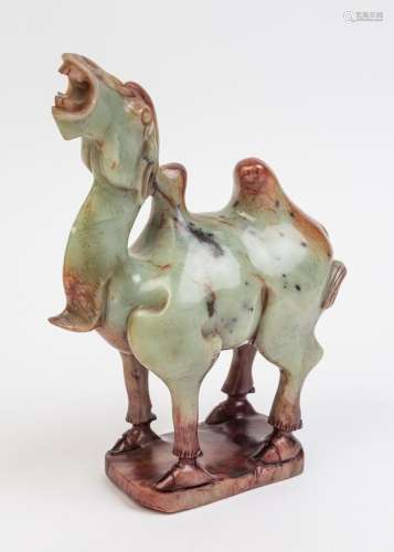 A Chinese green hardstone figure of a camel. 10 in. (25.40 c...