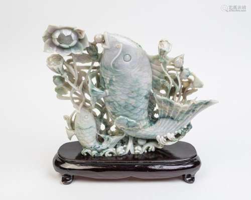 A Chinese jadeite carved model of carp amongst lotus plants,
