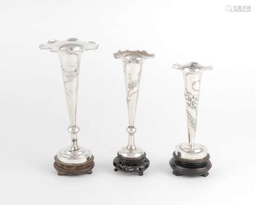 A collection of three Chinese silver vases