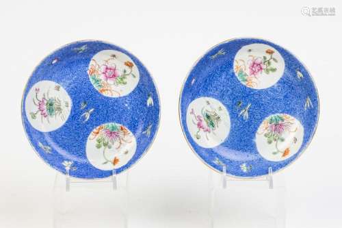 A pair of famille rose sgraffito blue ground saucer dishes, ...