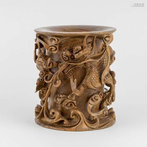 A wooden bitong carved in high relief, 7 3/4 in. (19.5 cm) h...