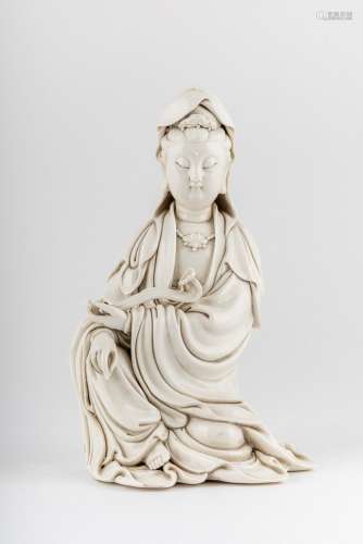 A Blanc de Chine seated figure of Guanyin, 13 1/2 x 8 x 7 1/...