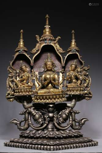 Qing Dynasty, bronze gilt with four arms and three sitting B...