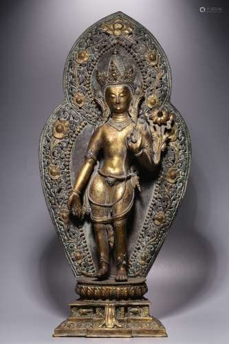 Qing Dynasty, bronze gilt image of Guanyin holding lotus wit...