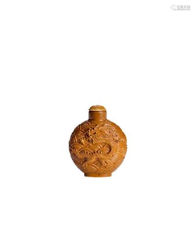 A CARAMEL-GLAZED CARVED PORCELAIN SNUFF BOTTLE 1820-1860